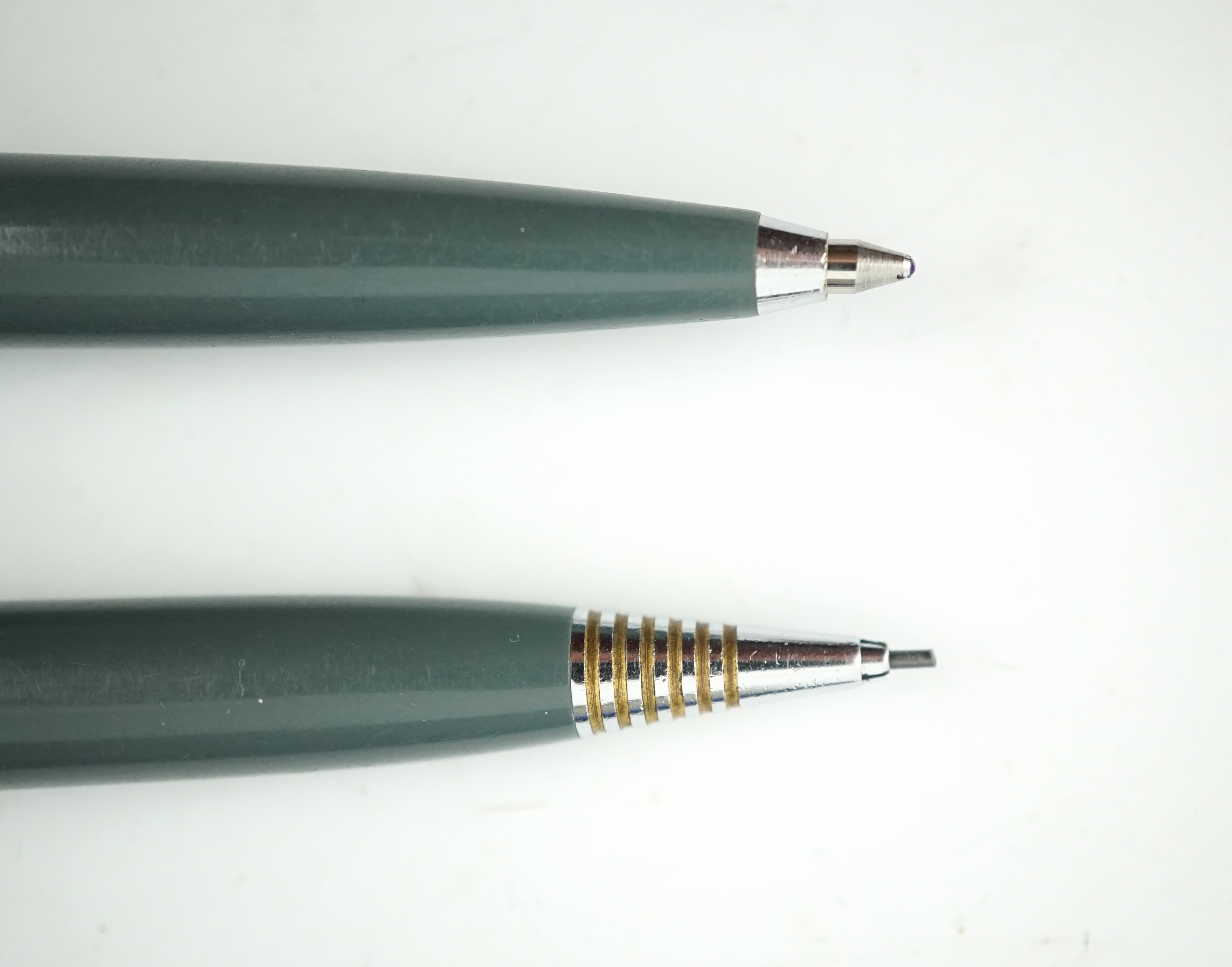 A Parker '51' Aerometric fountain pen, ball pen and pencil in grey